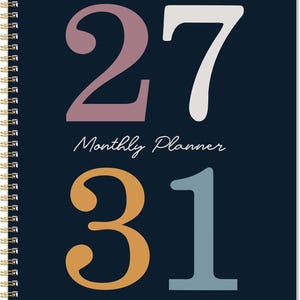 May include: A dark navy blue spiral-bound monthly planner featuring the large numbers 27 and 31 printed in muted mauve, cream, mustard yellow, and slate blue. The text Monthly Planner is centered in white script font between the two sets of numbers.