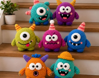 May include: A collection of seven colorful crocheted monster plush toys. The creatures feature various shapes, sizes, and expressions, with details like horns, single or double eyes, and small mouths. They are crafted in vibrant yarn colors including teal, purple, lime green, magenta, blue, and orange.