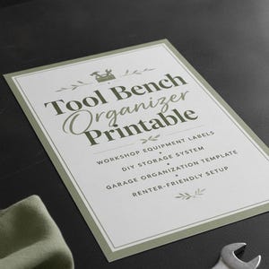 May include: A rectangular printable document with a sage green border and white background. The text reads: Tool Bench Organizer Printable, Workshop Equipment Labels, DIY Storage System, Garage Organization Template, Renter-Friendly Setup.