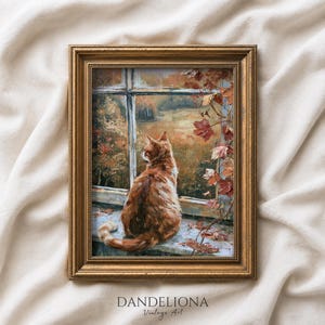 Puede incluir: Una pintura al óleo en un marco dorado que muestra a un gato atigrado naranja sentado en el alféizar de una ventana, mirando un paisaje otoñal con árboles y follaje. El texto DANDELIONA Vintage Art está impreso en negro en la parte inferior.