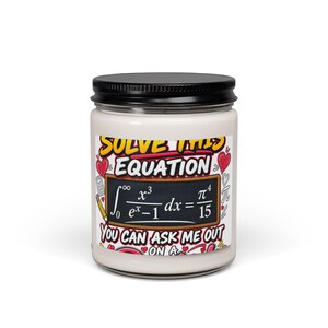 May include: A white candle in a glass jar with a black lid. The label features the text "SOLVE THIS EQUATION YOU CAN ASK ME OUT ON A" surrounding a blackboard graphic displaying a complex calculus integral equation, decorated with red hearts.