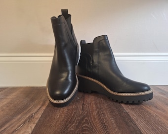 DV Dolce Vita size 8, Chelsea style black ankle bootie, easy to pull on and off.   Very clean.  2.25 heel height, lugged sole.