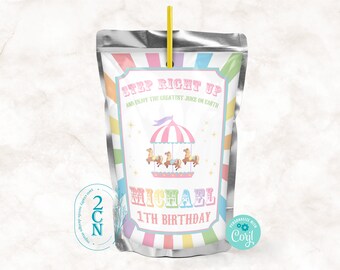 Könnte beinhalten: Ein farbenfrohes Saftbox-Etikett mit einem Karussell-Design. Das Etikett lautet "Step Right Up and Enjoy the Greatest Juice on Earth". Es steht auch "Michael 1st Birthday" drauf.