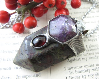 the north star - dragons blood jasper crystal pendant with ruby & garnet