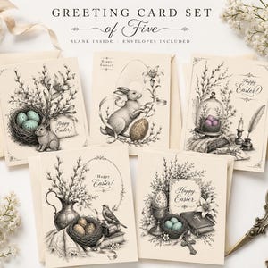 May include: A set of five cream-colored greeting cards featuring detailed black and white ink illustrations of Easter themes including rabbits, birds, nests with eggs, lilies, and books. Each card displays the text Happy Easter in elegant script.