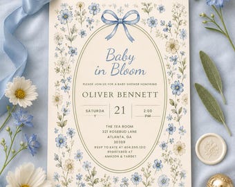 May include: A rectangular baby shower invitation card featuring a cream background with a blue bow and floral border. The text reads Baby in Bloom, Oliver Bennett, Saturday 21, 2:00 PM, The Tea Room, 321 Rosebud Lane, Atlanta, GA 30309, RSVP to Kate at 404.555.1212, Registered at Amazon & Target.