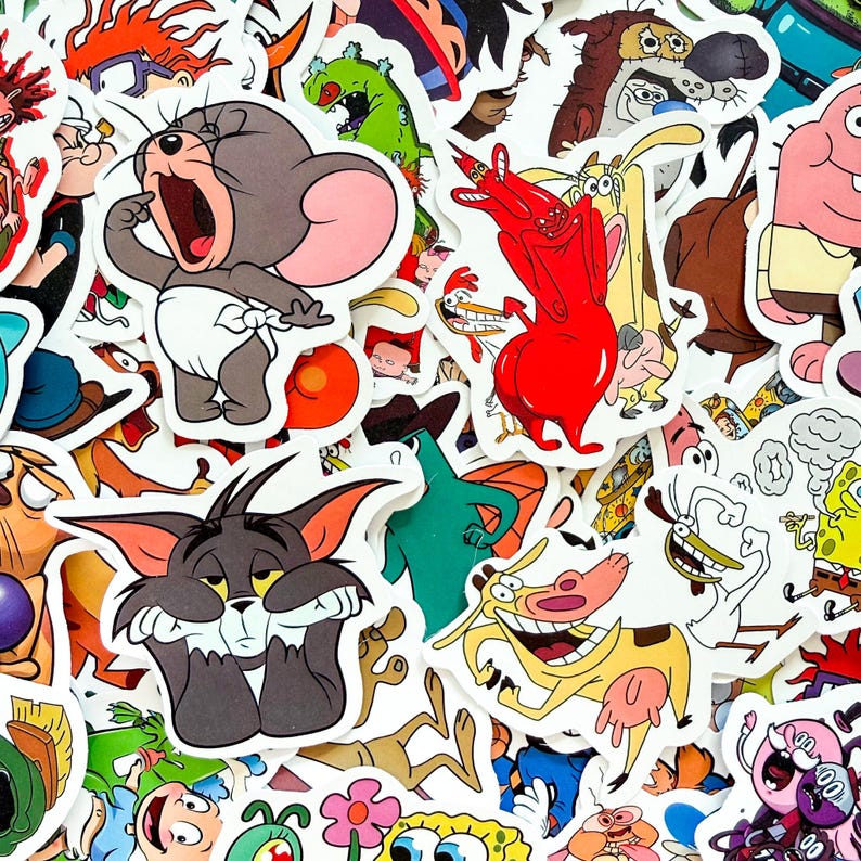 May include: A collection of assorted vinyl stickers featuring various colorful cartoon characters including Jerry the mouse, Tom the cat, Cow and Chicken, Spongebob Squarepants, and other animated figures with distinct outlines and vibrant colors.