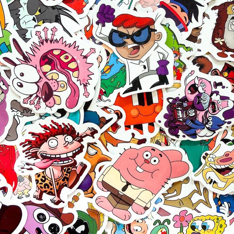 May include: A collection of colorful vinyl stickers featuring various cartoon characters including Dexter, Courage the Cowardly Dog, Donnie Thornberry, Richard Watterson, and SpongeBob SquarePants, all arranged in a dense, overlapping collage.