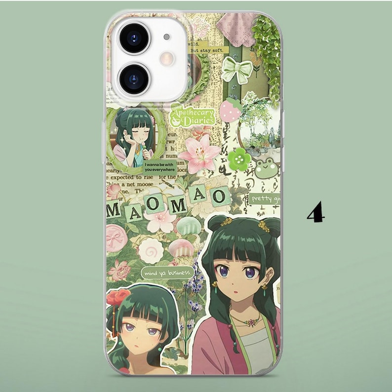 May include: A clear phone case featuring a collage of anime-style illustrations of a character with dark green hair, the text MAOMAO, Apothecary Diaries, and mind ya business, alongside floral motifs, a green bow, and a small frog graphic.