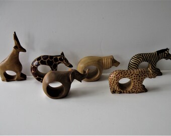 Carved wood animal napkin rings from Kenya Africa antelope giraffe zebra lion sculptures hand carved artisan table art set of 4