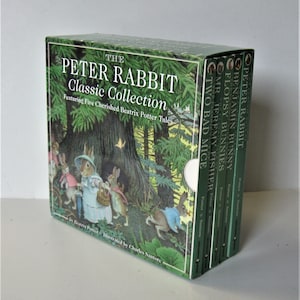 May include: A boxed set of "The Peter Rabbit Classic Collection" books. The box and book spines are green with white text. The box features an illustration of Peter Rabbit and friends in a forest setting. The set includes five cherished Beatrix Potter tales.