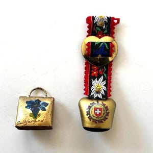2 Vintage Brass Swiss Cow Bells, flowers, fringed and embroidered strap, cutout heart embellishment, red cross, Bavarian souvenirs, gift