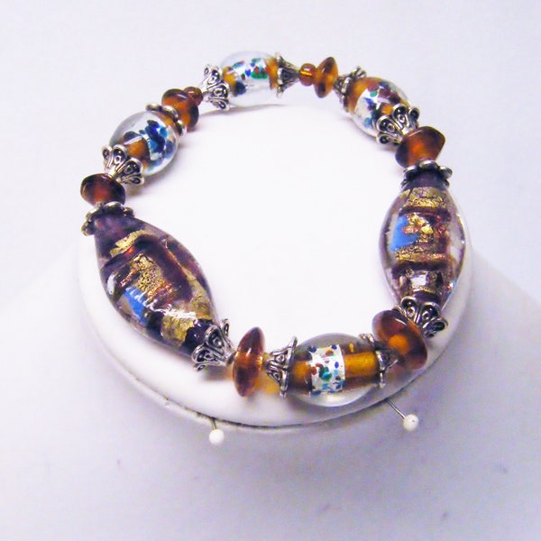 Oval Brown Transparent w/Speckle Foil Line Glass Bead Bracelet