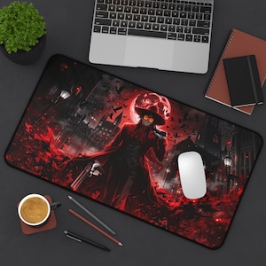 May include: A rectangular desk mat featuring a dark, gothic-inspired illustration of a character in a long red coat and wide-brimmed hat, holding a handgun. The scene includes a large red moon, flying birds, and a silhouetted cityscape in red and black.