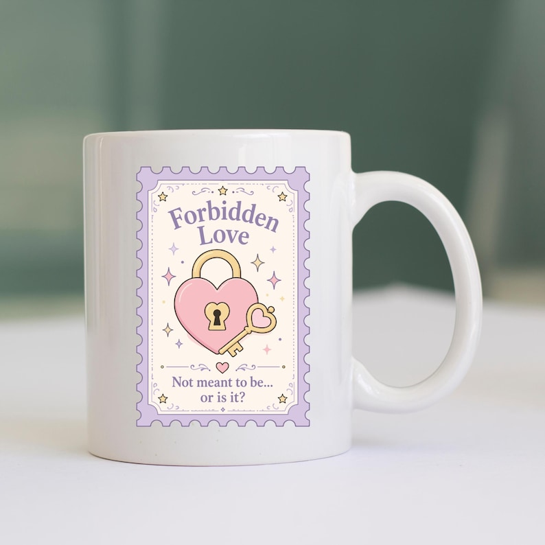 May include: A white ceramic mug featuring a postage stamp-shaped graphic with a light purple border. The design includes a pink heart-shaped padlock, a gold key, and the text "Forbidden Love" above and "Not meant to be... or is it?" below.