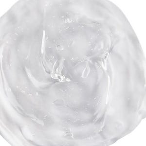 May include: A dollop of clear, viscous gel with a smooth, semi-translucent texture. The substance features a glossy, reflective surface with small, scattered air bubbles trapped within the thick, jelly-like consistency of the clear liquid.