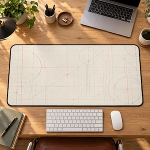 May include: A rectangular desk mat featuring a cream-colored surface with a technical drafting pattern. The design includes thin black and red lines, geometric circles, and intersecting grid markings across the entire mat.