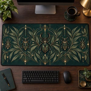 May include: A rectangular desk mat featuring a dark green background with a symmetrical pattern of five gold-toned beetles and stylized foliage. The design includes thin gold geometric lines and arches that frame the insects across the surface.