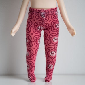 May include: Pink patterned tights with a white floral design.