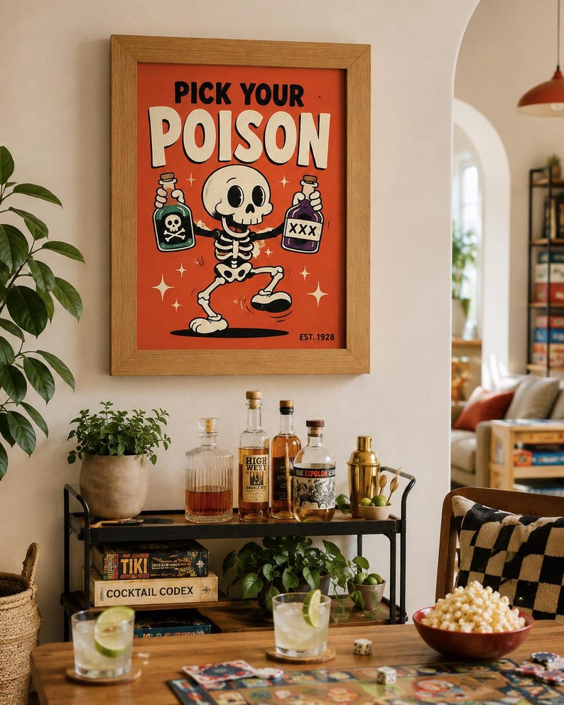 May include: A framed wall art print featuring a cartoon skeleton on a red background with the text PICK YOUR POISON and EST. 1928. The skeleton holds a green bottle with a skull and crossbones and a purple bottle labeled XXX, surrounded by stars.