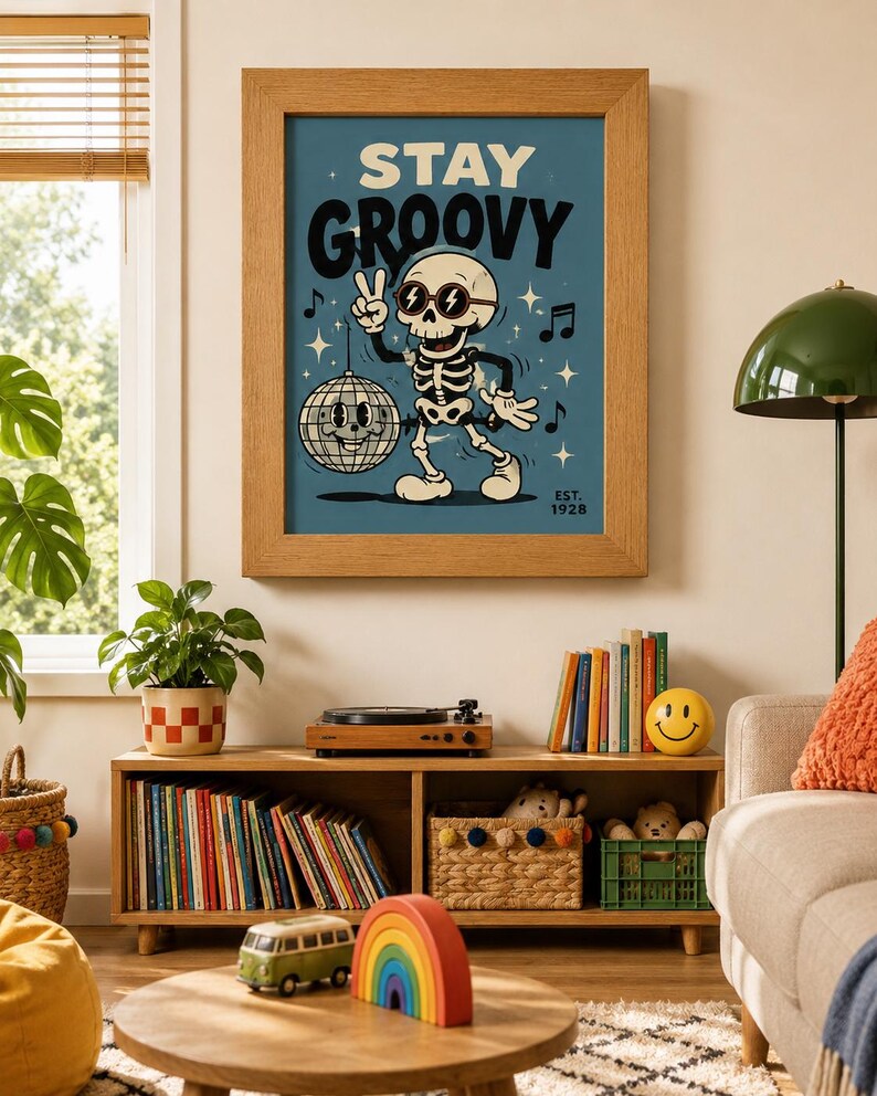May include: A framed wall art print featuring a cartoon skeleton wearing sunglasses and making a peace sign. The skeleton stands next to a disco ball on a blue background with the text STAY GROOVY and EST. 1928. Musical notes and stars surround the figure.
