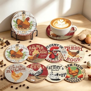 May include: A set of round drink coasters featuring colorful diamond art designs of chickens, roosters, and farm-themed text like Chicken Coop, Fresh Eggs, and Farmer's Market. The coasters are displayed in a black metal holder and on a wooden surface.