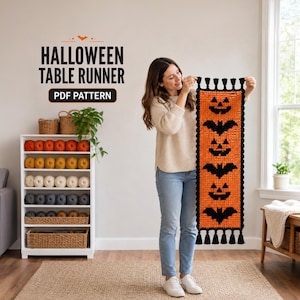 May include: A rectangular crochet table runner featuring an alternating pattern of black jack-o'-lanterns and bats on an orange background, finished with black tassels at both ends. The text HALLOWEEN TABLE RUNNER PDF PATTERN is visible.