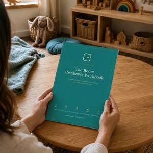 May include: A teal-colored workbook titled The Room Readiness Workbook with white text and a small yellow circle logo at the top. The cover features a subtitle and five small circular icons with text labels arranged horizontally near the bottom.