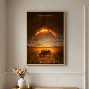 May include: A rectangular wall poster featuring a dark landscape with a car driving on a road toward a glowing, fiery arch in the sky. The text GOOD TIMES. BAD TIMES. END TIMES. appears at the top, and the word SUPERNATURAL is at the bottom.
