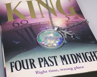 Bookish necklace: Four Past Midnight by Stephen King. Langoliers. Aurora borealis. With or without the airplane charm.