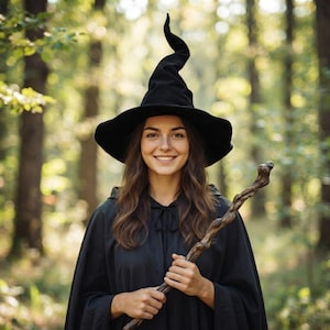May include: A black pointed witch hat with a wide brim and a tall, slightly curved crown, paired with a black hooded cloak featuring a tie closure at the neck, and a long, gnarled wooden staff with a textured, twisted surface and a knot at the top.
