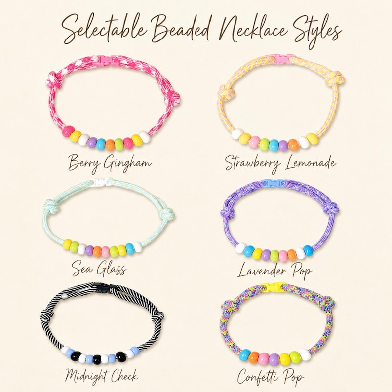 May include: Six beaded necklaces labeled Selectable Beaded Necklace Styles. The styles are Berry Gingham, Strawberry Lemonade, Sea Glass, Lavender Pop, Midnight Check, and Confetti Pop. Each necklace features a cord with beads and a plastic clasp.