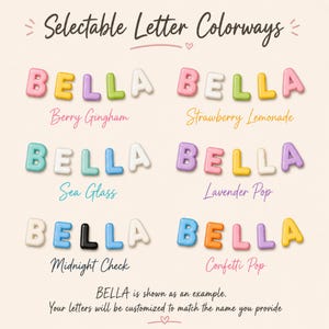 May include: A chart titled Selectable Letter Colorways displays six rows of the name BELLA in various pastel and bright color combinations. Each row is labeled with names like Berry Gingham, Strawberry Lemonade, Sea Glass, Lavender Pop, Midnight Check, and Confetti Pop. Text at the bottom states BELLA is shown as an example and letters will be customized to match the name provided.