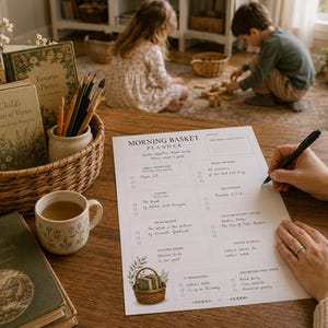 May include: A white Morning Basket Planner sheet with printed text and checkboxes, featuring a small illustration of a basket with books at the bottom. The planner includes sections for daily readings, nature study, and reminders, with handwritten text.