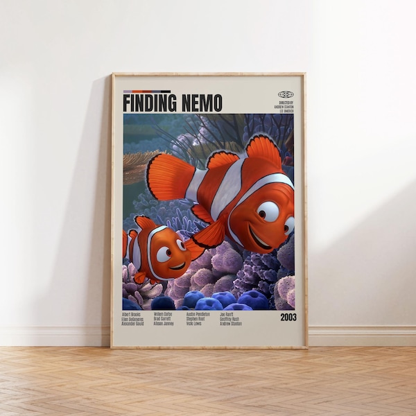 May include: A vertical poster featuring the Finding Nemo movie title at the top, with two orange and white clownfish swimming over a purple coral reef. The poster includes cast and crew credits, the year 2003, and a light beige background.