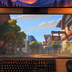 May include: A rectangular desk mat featuring a vibrant, stylized illustration of a fantasy village street. The scene depicts timber-framed buildings, a large central tree, and a cobblestone path under a bright blue sky with soft clouds.