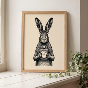 May include: A framed art print featuring a black and white ink-style illustration of a rabbit standing upright. The rabbit is holding a vintage-style pressure gauge with a circular dial and a needle pointing toward the center of the gauge face.