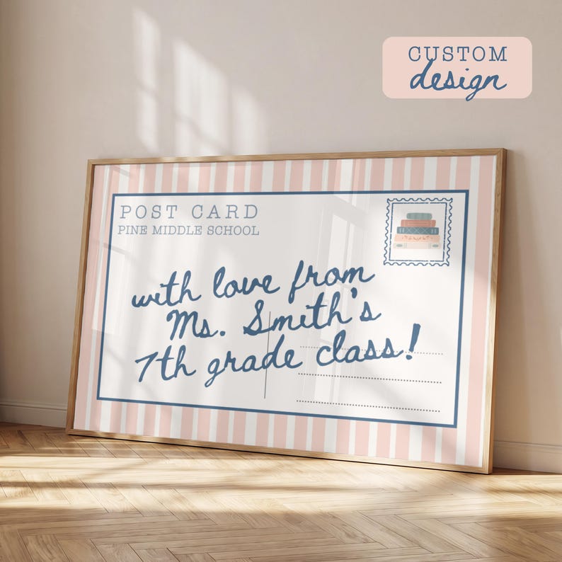May include: A framed rectangular print featuring a postcard design with vertical light pink and white stripes. The text reads POST CARD, PINE MIDDLE SCHOOL, and with love from Ms. Smith's 7th grade class! A stamp graphic shows a stack of books.