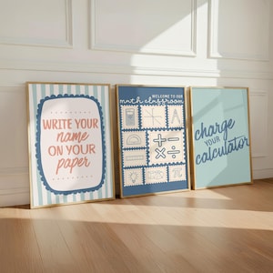 May include: Three framed posters for a classroom. The left poster has blue stripes and says "WRITE YOUR NAME ON YOUR PAPER". The middle blue poster features math icons and "WELCOME TO OUR MATH CLASSROOM". The right light blue poster says "charge your calculator".