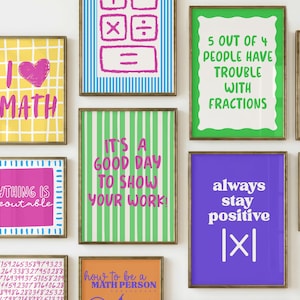 May include: A collection of framed wall art prints featuring mathematical themes, including text such as I LOVE MATH, 5 OUT OF 4 PEOPLE HAVE TROUBLE WITH FRACTIONS, EVERYTHING IS FIGUREOUTABLE, IT'S A GOOD DAY TO SHOW YOUR WORK, and always stay positive.