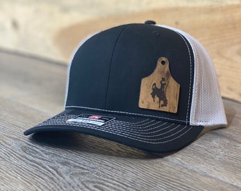 Wyoming Cowboy Leather Cow Tag Patch Black/White Snapback Hat