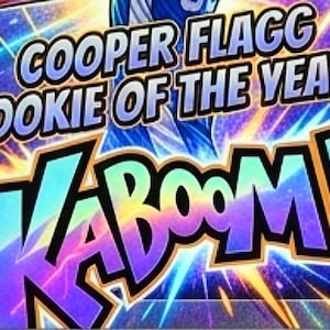 May include: A rectangular sports trading card featuring a basketball player in a blue jersey with the number 32. The card displays the text COOPER FLAGG ROOKIE OF THE YEAR and the word KABOOM in large, colorful, comic-style lettering against a background.