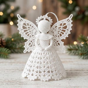 May include: A white crocheted angel ornament featuring a round head with a halo, a flared dress with a scalloped hem, and intricate lace-like wings. The figure is crafted from fine white thread and includes a small white ribbon loop at the top.