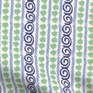 May include: A white fabric with a repeating pattern of blue and green swirls, blue beads, and green flowers.