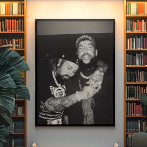 May include: A black and white framed wall art print featuring two tattooed individuals embracing, wearing baseball caps and chain necklaces. The print includes text at the bottom that reads: VISIT: https:// and Come and say good.