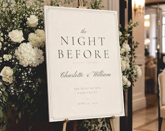 May include: A rectangular white wedding sign on a gold easel featuring black serif text that reads: the NIGHT BEFORE, Charlotte & William, THE HILLS ESTATE, NAPA VALLEY, JUNE 14, 2016. The sign has a thin black double-line border.