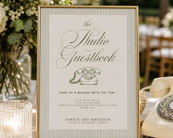 Puede incluir: Un letrero rectangular con marco dorado que presenta el texto "the Audio Guestbook" en letra elegante, un dibujo lineal de un teléfono de disco e instrucciones para dejar un mensaje. Incluye los nombres "Janice and Brendan" y la fecha "05.13.27".