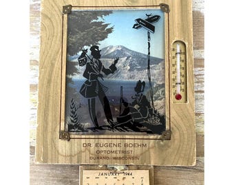 Calendario con termómetro publicitario antiguo, silueta de Durand, Wisconsin, 1944, vidrio curvado.
