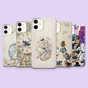 May include: Five clear smartphone cases featuring illustrations inspired by Alice in Wonderland. Designs include a white rabbit with a pocket watch, a girl with a rabbit, a girl standing near a bottle labeled Drink Me, and playing card motifs.