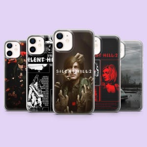 May include: Five clear smartphone cases featuring Silent Hill 2 themed graphics. Designs include a character surrounded by hands, a black and white collage with a pyramid-headed figure, a red and black portrait, and a misty landscape scene.